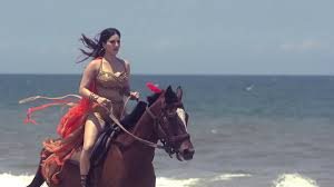 Sunny Leone riding a Horse through the Beach